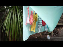 Load and play video in Gallery viewer, PeggyRain clothesline Peggy Rain Drying your washing outside. Washing line outside drying clothes in the weather and Rain. Laundry outside. Clothes horse drying washing. Clothesline covered canopy automatic rain sensor. How to dry my washing laundry outside in the irish and british and american canadian weather